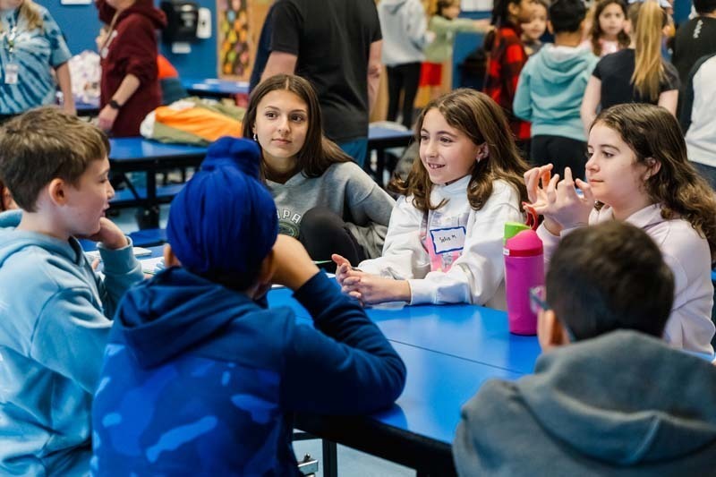 Bethpage High School athletes returned to their elementary school roots on Dec. 5, bringing mentorship and inspiration to fifth graders at Charles Campagne School through the Athletes Helping Athletes program.