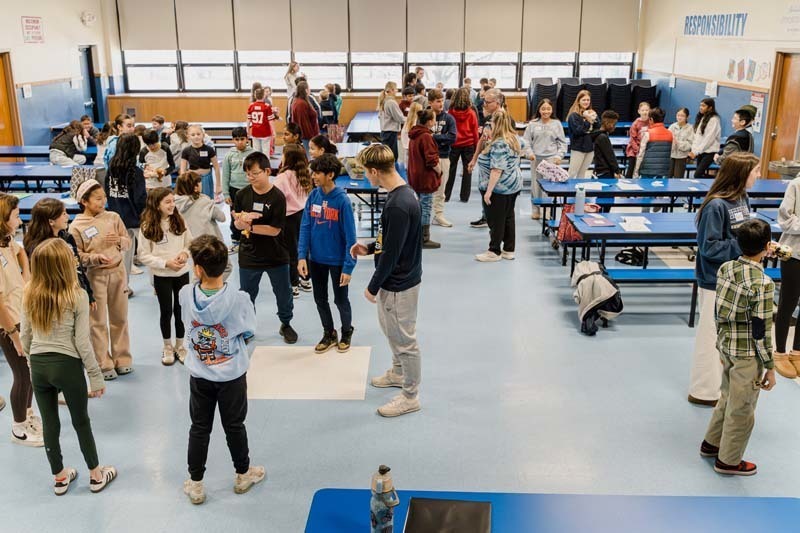 Bethpage High School athletes returned to their elementary school roots on Dec. 5, bringing mentorship and inspiration to fifth graders at Charles Campagne School through the Athletes Helping Athletes program.