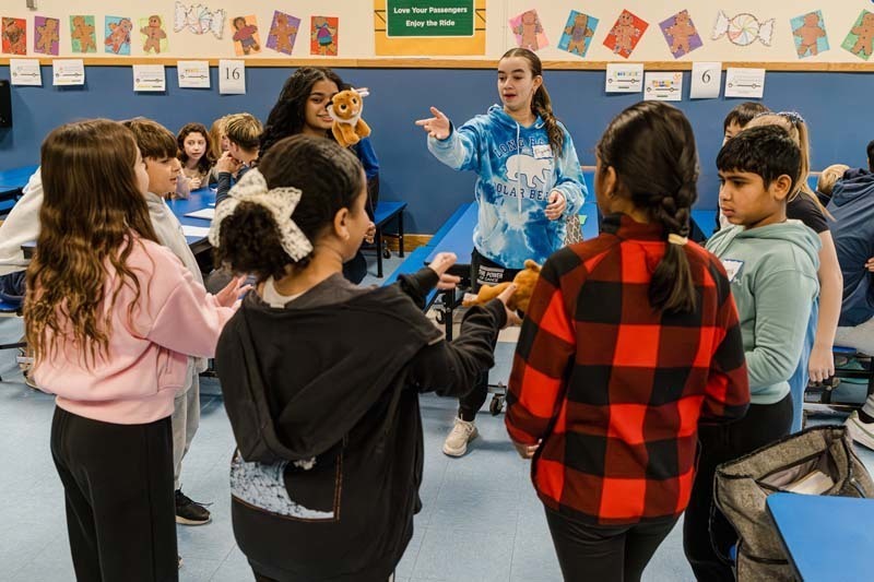 Bethpage High School athletes returned to their elementary school roots on Dec. 5, bringing mentorship and inspiration to fifth graders at Charles Campagne School through the Athletes Helping Athletes program.