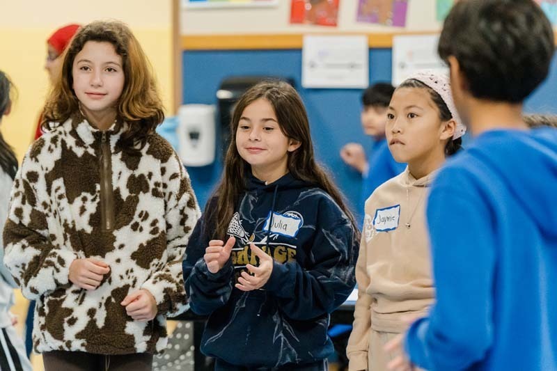 Bethpage High School athletes returned to their elementary school roots on Dec. 5, bringing mentorship and inspiration to fifth graders at Charles Campagne School through the Athletes Helping Athletes program.
