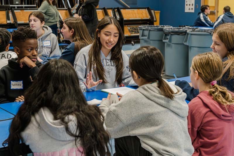 Bethpage High School athletes returned to their elementary school roots on Dec. 5, bringing mentorship and inspiration to fifth graders at Charles Campagne School through the Athletes Helping Athletes program.