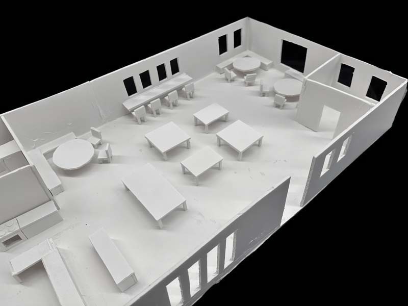 A white foam core scale model from a high school architecture class