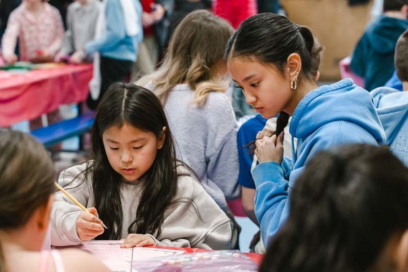 Fourth graders at CCS welcomed special guests of their choosing for a Valentine's Day celebration that blended learning with fun.
