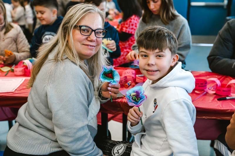 Fourth graders at CCS welcomed special guests of their choosing for a Valentine's Day celebration that blended learning with fun.