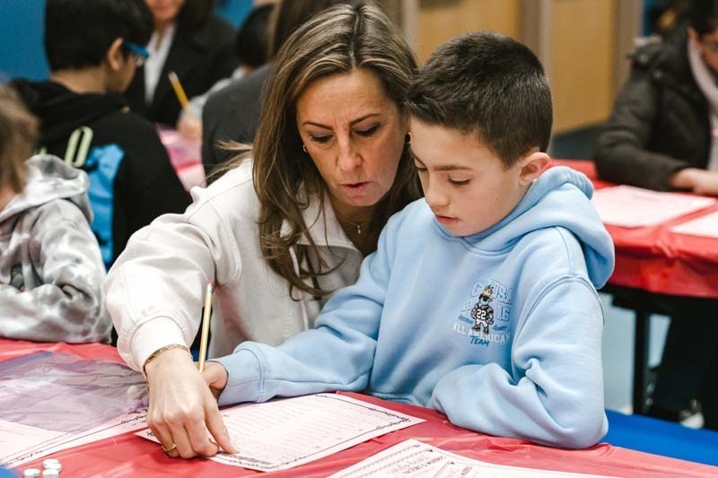 Fourth graders at CCS welcomed special guests of their choosing for a Valentine's Day celebration that blended learning with fun.