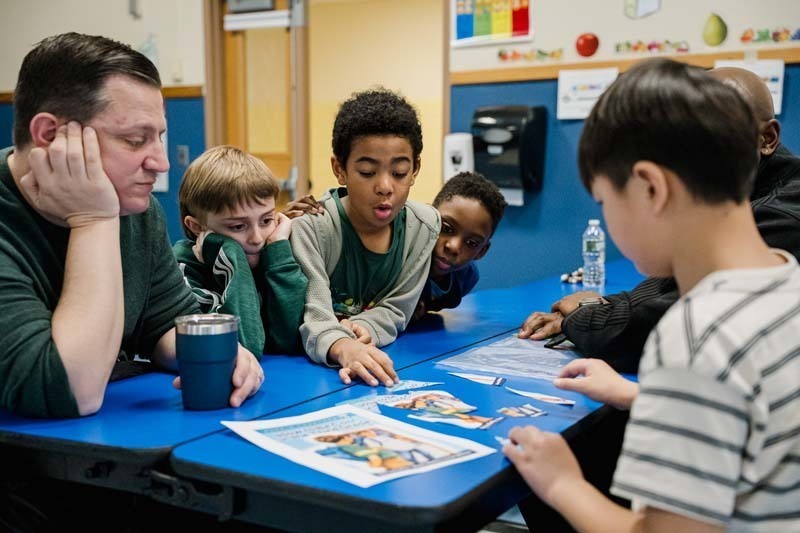 Student and parent working on project.