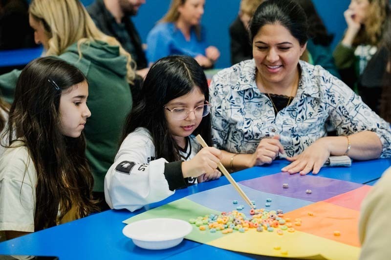 Student and parent working on project.