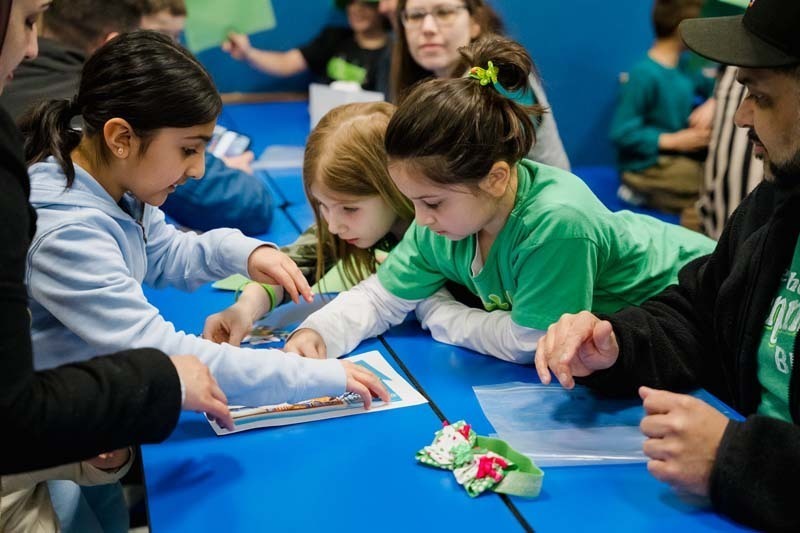 Student and parent working on project.