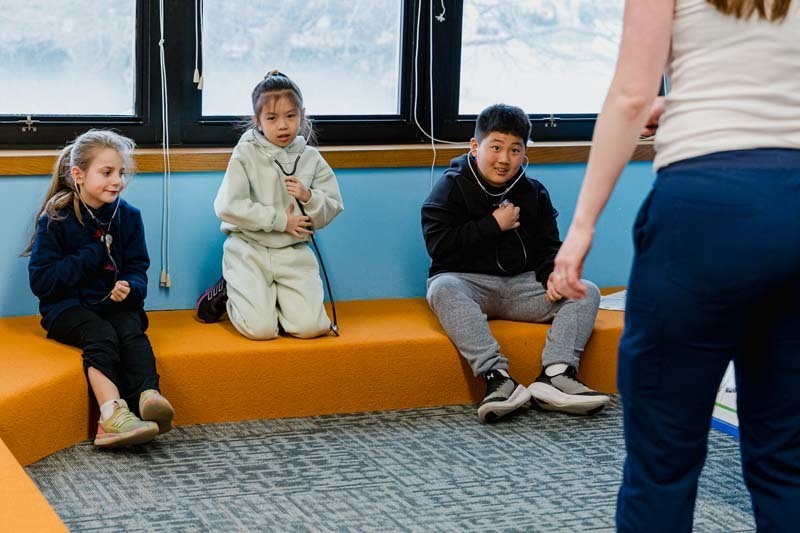 Students sitting on couch.