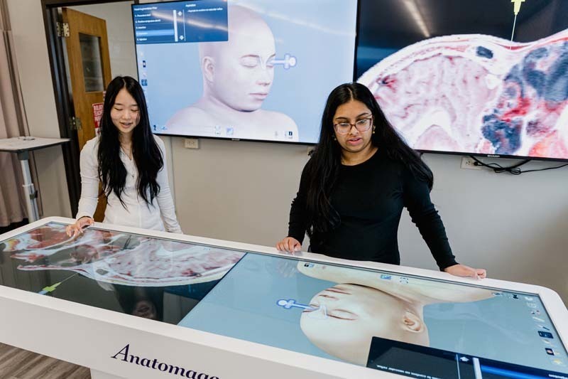 Students looking at large screen.