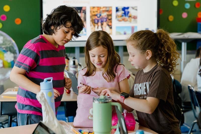 Students discussing their projects together.