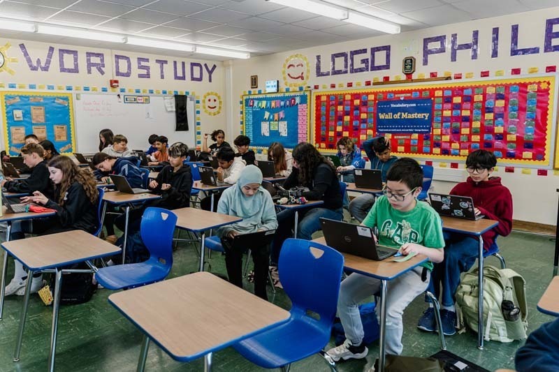 Student working on laptop.