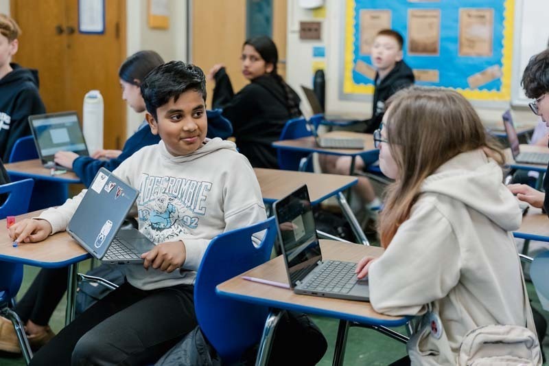 Student working on laptop.