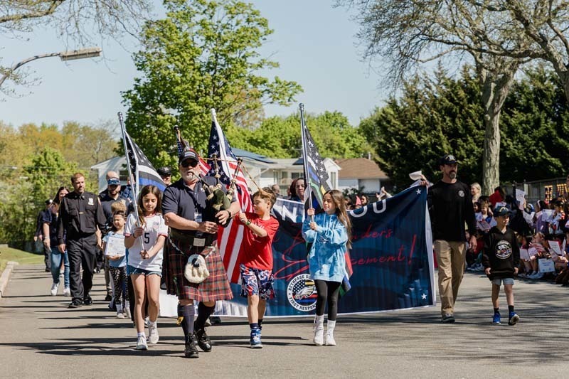 Charles Campagne Elementary School marked the first day of May with an enthusiastic tribute to local first responders