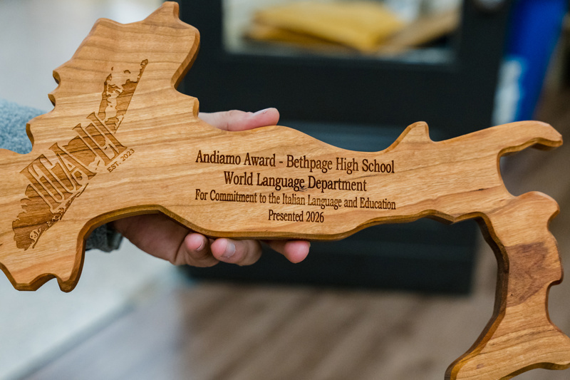 Andiamo Award plaque presented by Bethpage High School's World Language Department, recognizing commitment to Italian language and education, engraved on a wooden map design, presented in 2026.