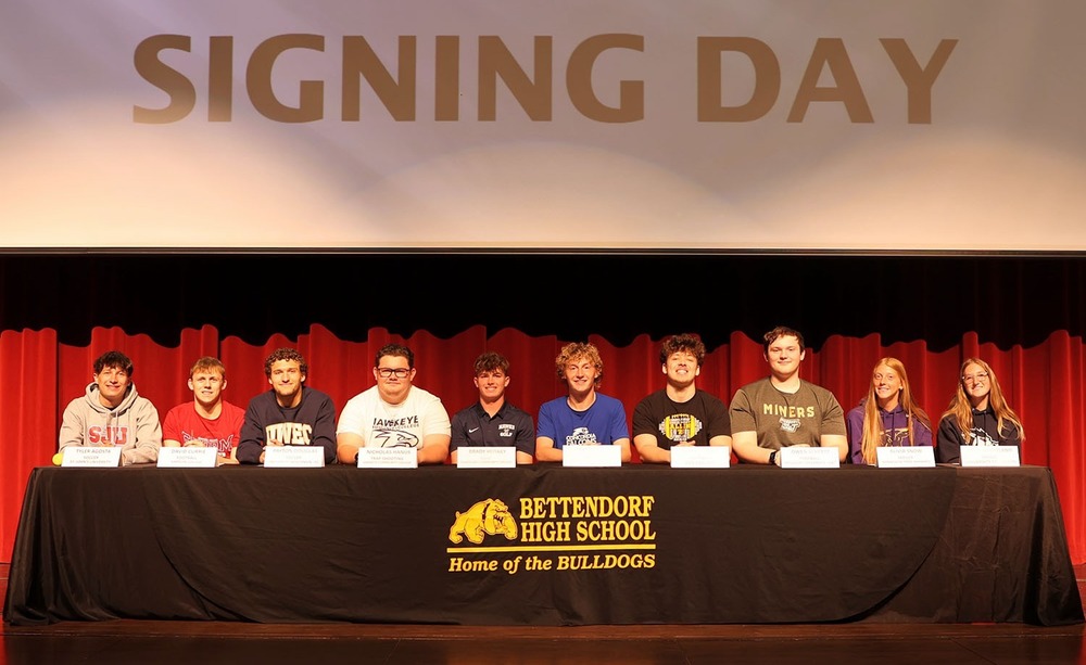 Student Althetes on stage for signing day