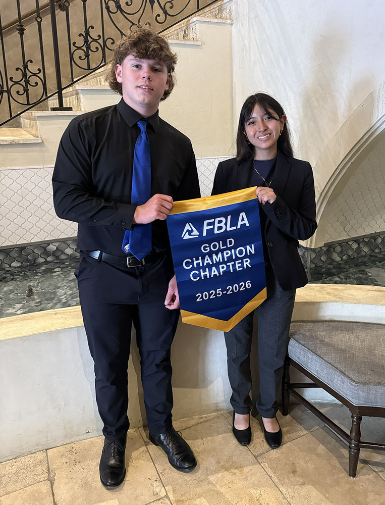 Preston Tennant and Maritza Aragon holding the FBLA Gold Champion Chapter 2025-2026 banner