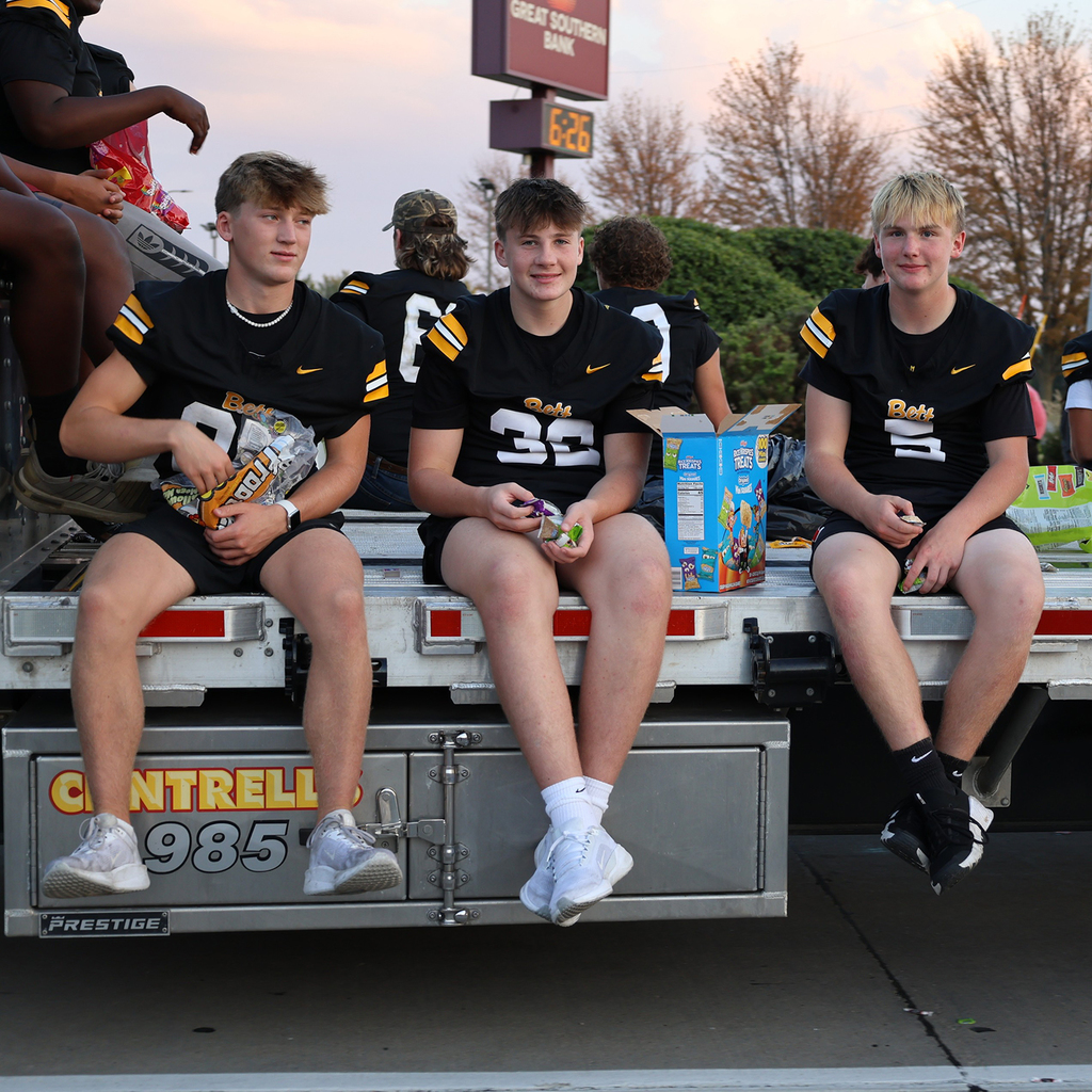 BHS football players smiling from their float