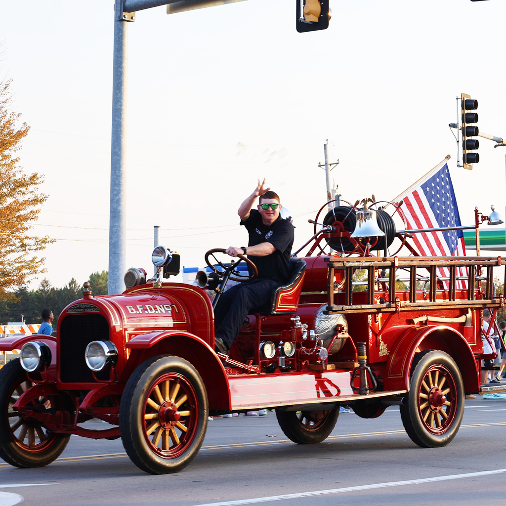 Bettendorf fireman in an antique fire truck