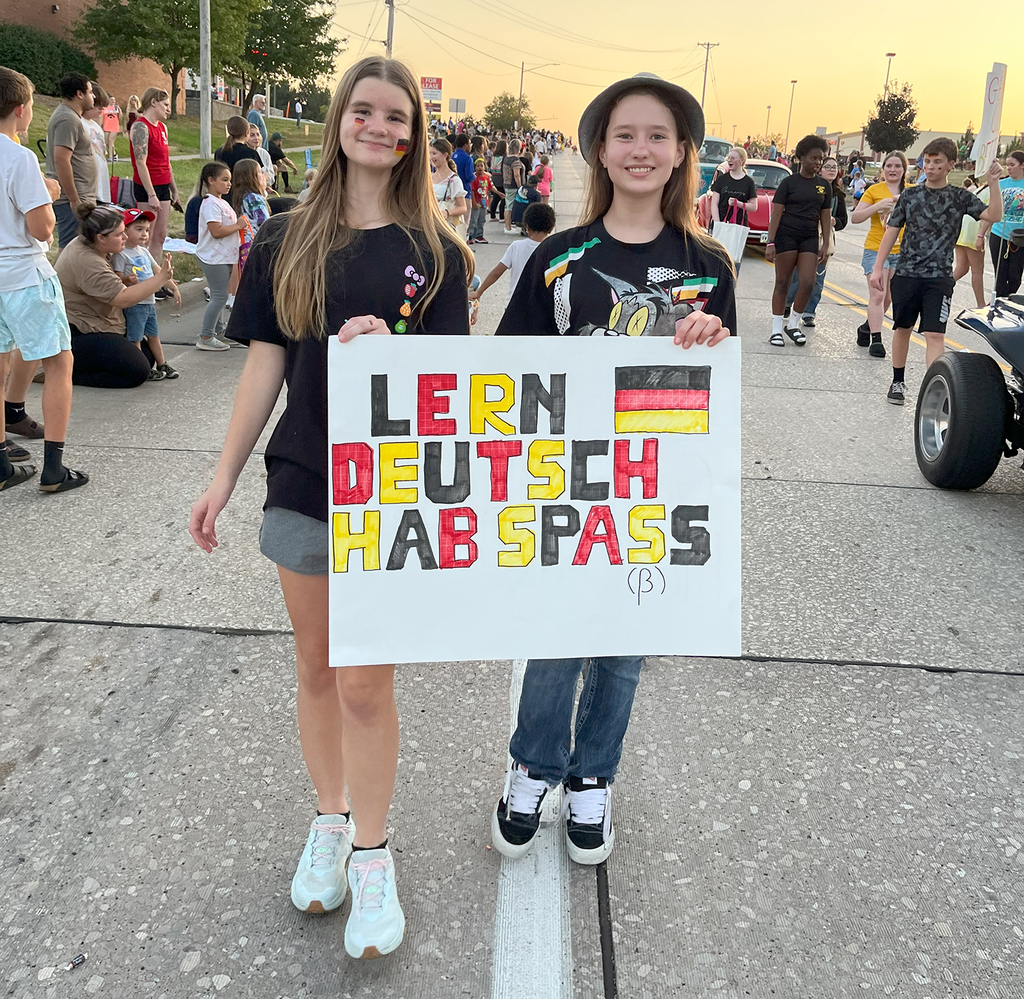 German Club students holding a sign in the parade