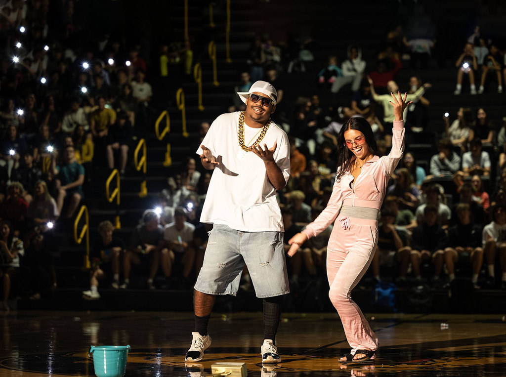 Armon and Eva flashing at the pep assembly