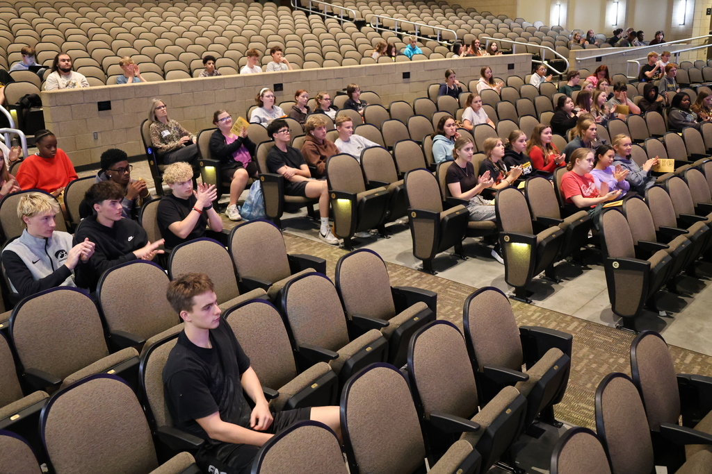 Students listening to speakers representing colleges