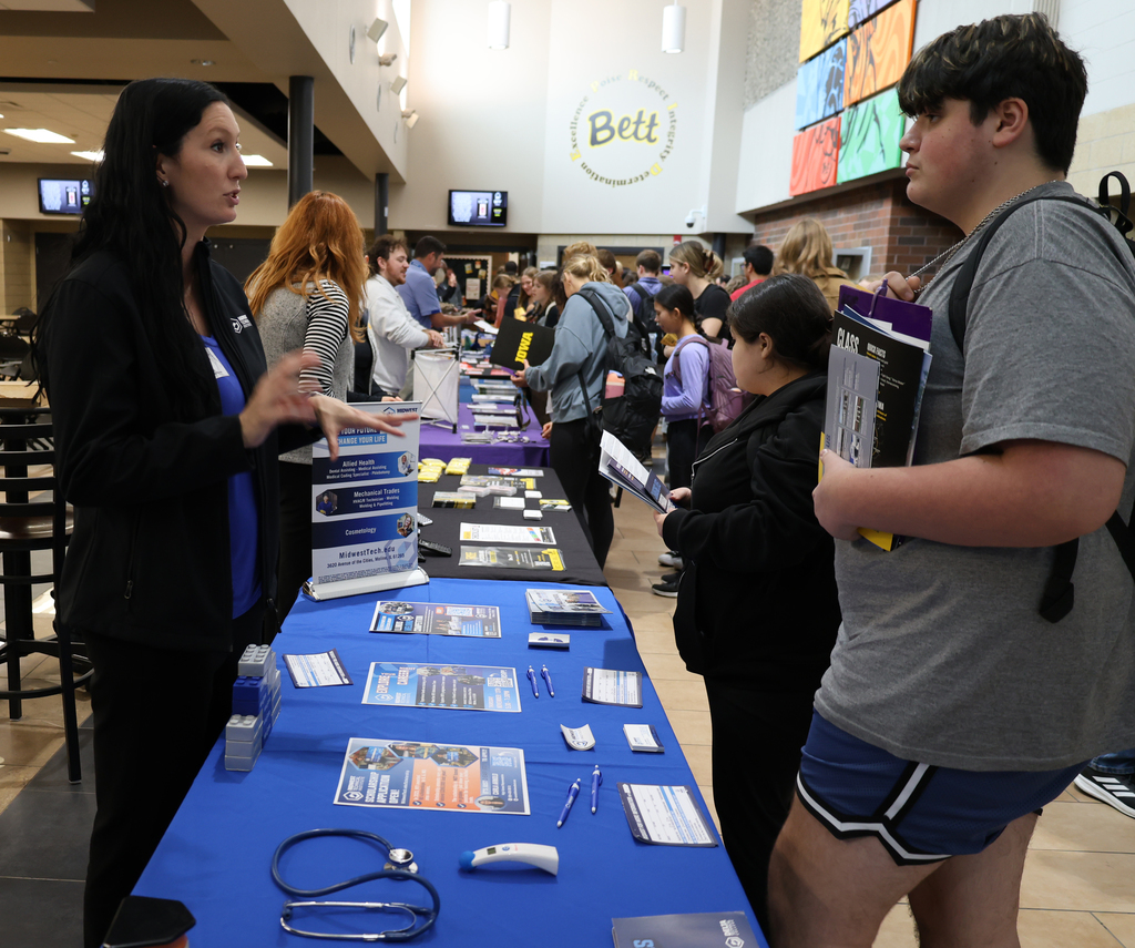 Student visiting with a  rep from Midwest Technical Institute