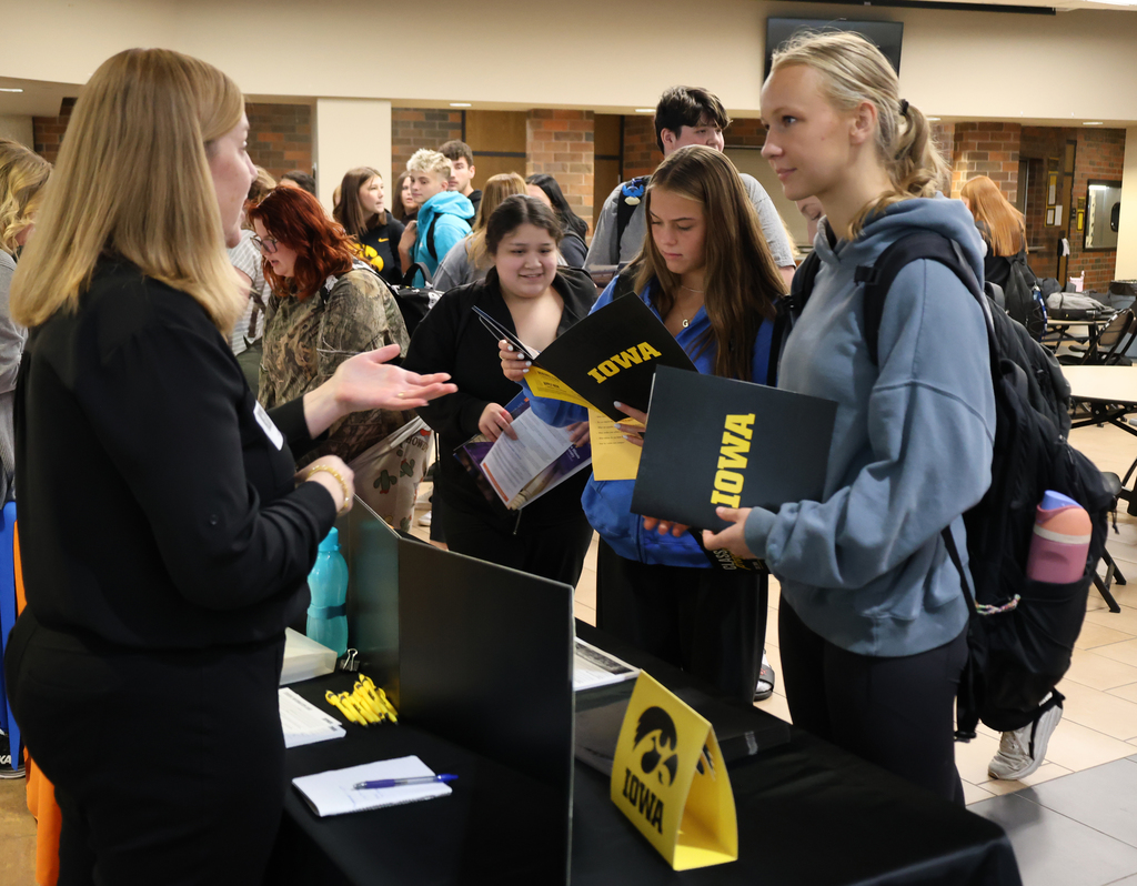Student visiting with a college rep from Iowa