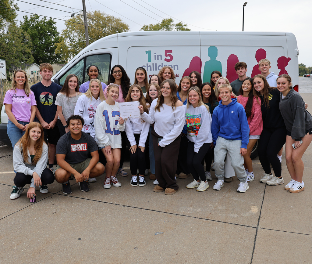 BHS Student Council with their certificat in front of the River Bend Food Bank van.
