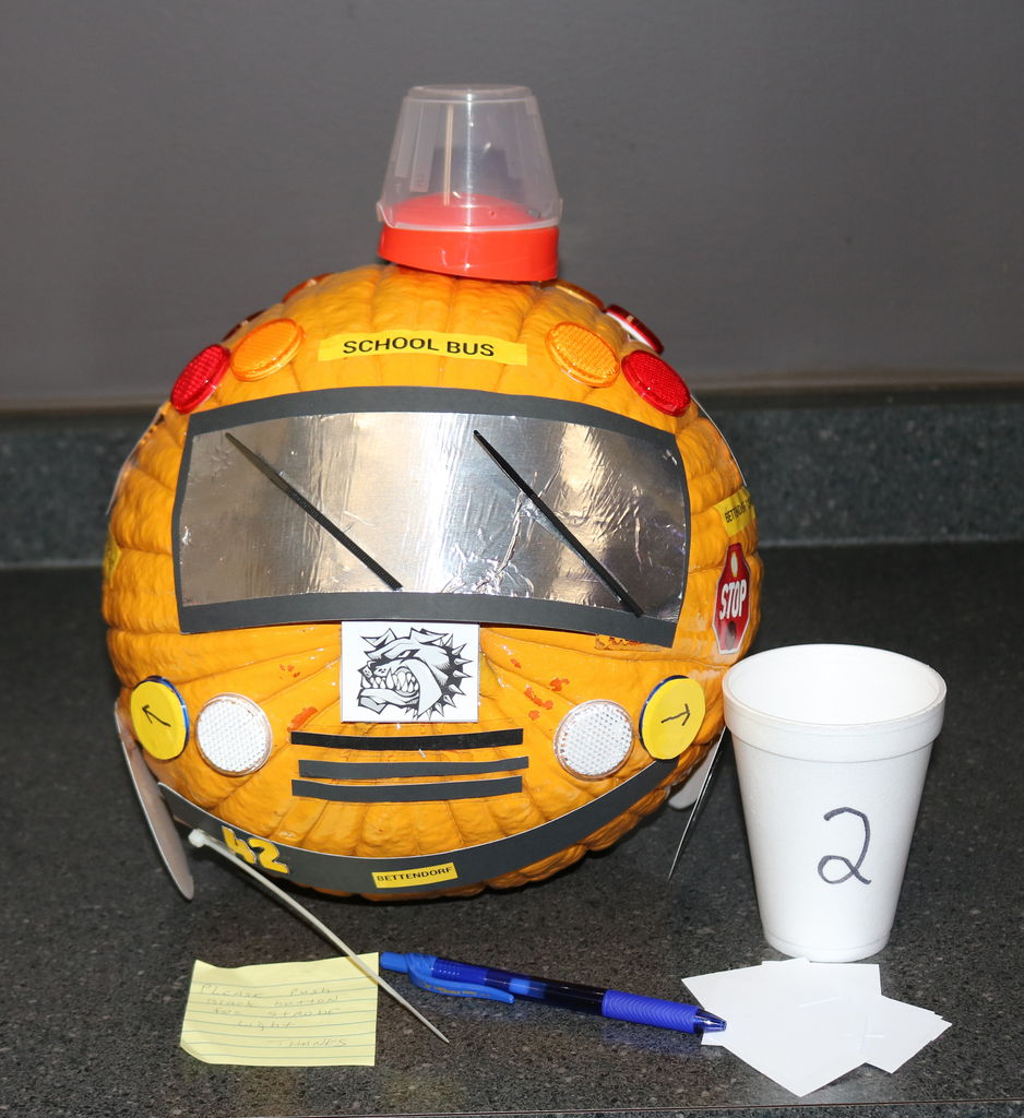 Transportation - School bus pumpkin with wheels, numbers, signs and light, windshield wippers, and stop arm, with a strob light on top