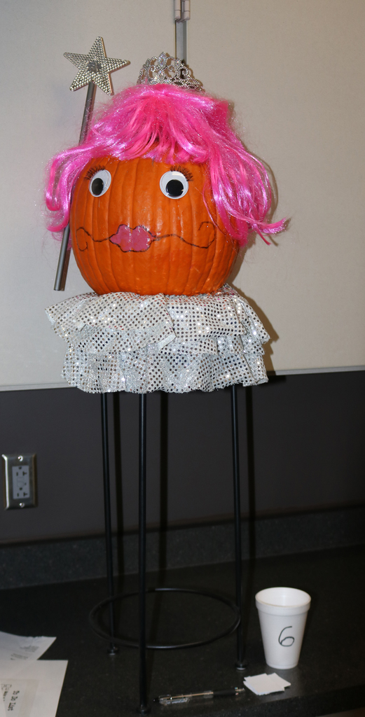 Student Services Princess pumpkin with pink hair wig, giant google eyes, and a sparkly star wand