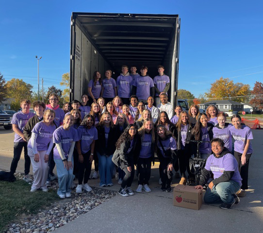Students posing with the loaded truck