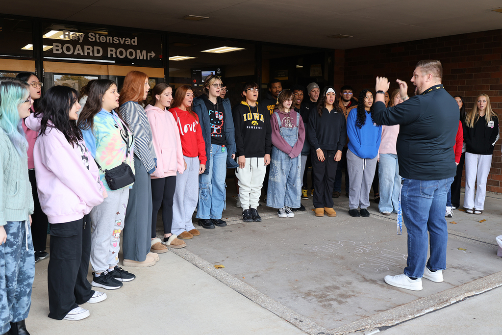 Director Teske and choir students at HS Veterans Day Ceremony