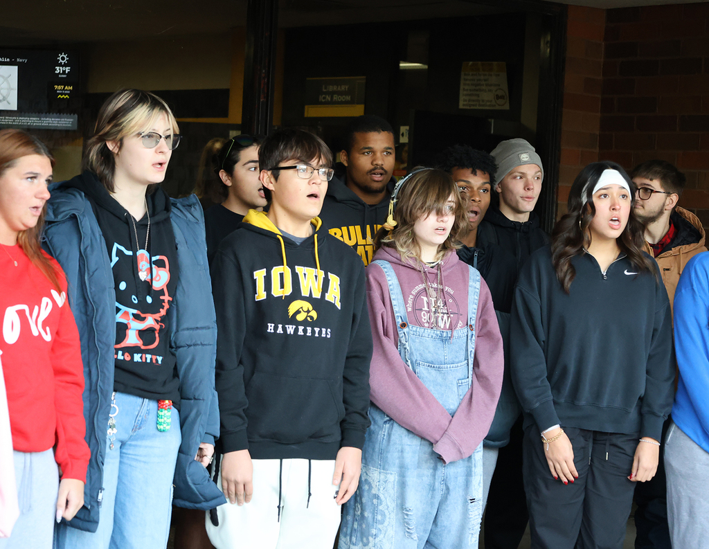 Choir students singing National Amthem at HS Veterans Day Ceremony