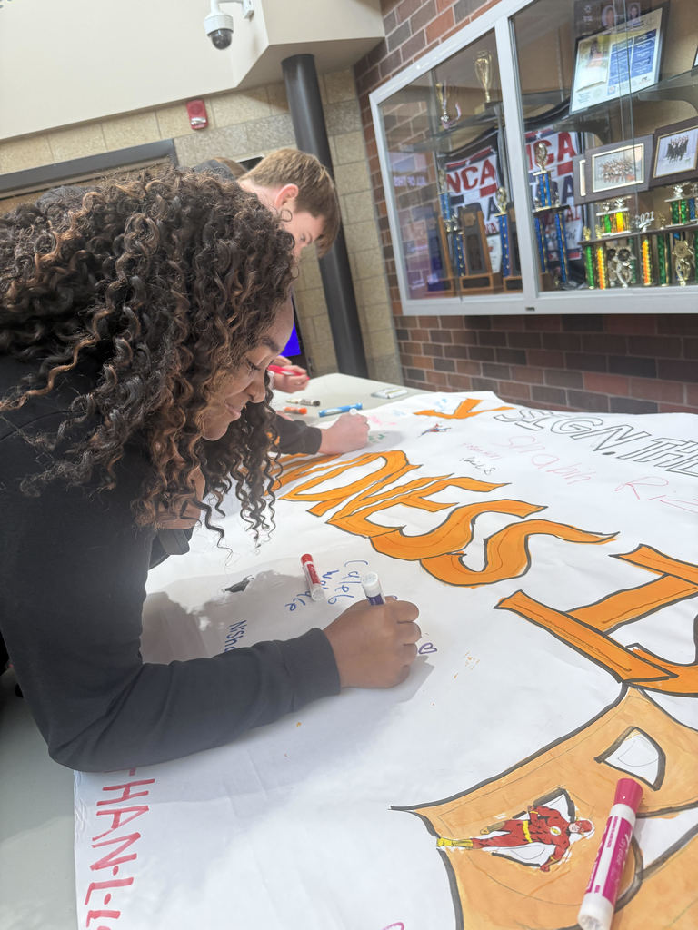 HS students signing a pledge to be kind.