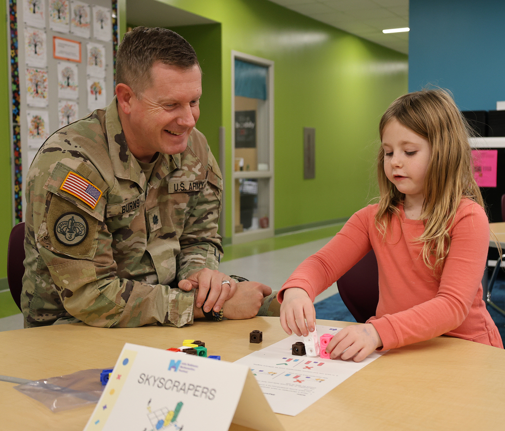Math Night 2025 - father and daughter laying out skyscrapers