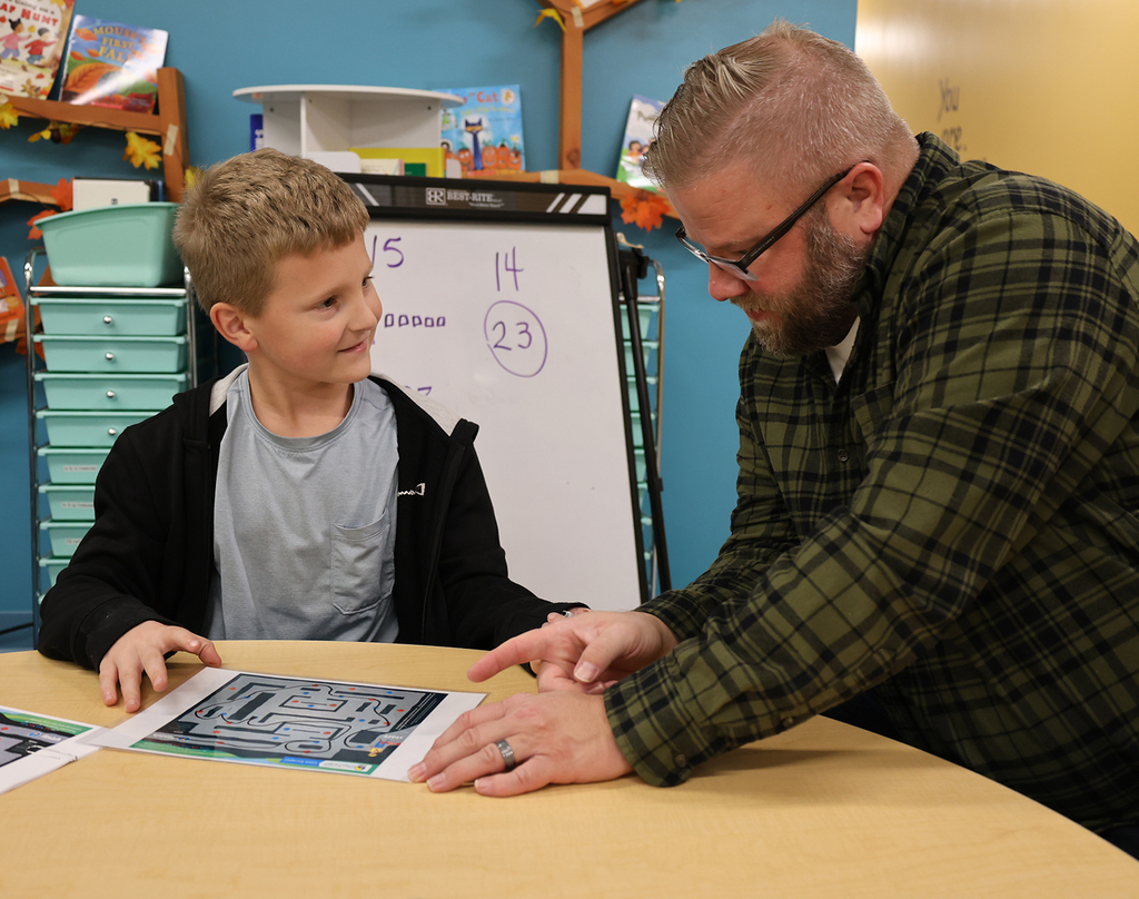 Math Night 2025 - father and son working on a math maze