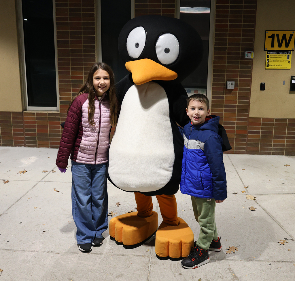 Math Night 2025 - Jiji poses with students