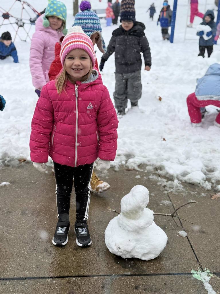 Girl with her mini snowman