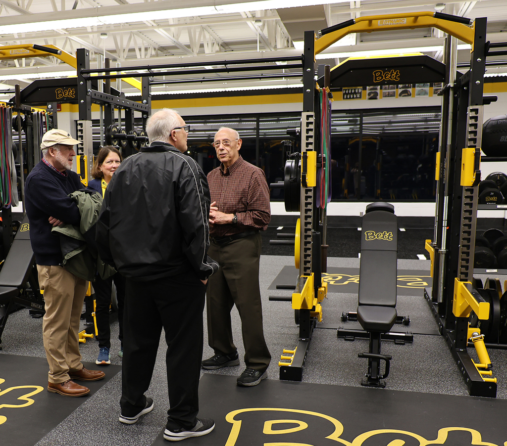 Director Castro visiting with Coach Scott,retired BHS PE teacher, and guests