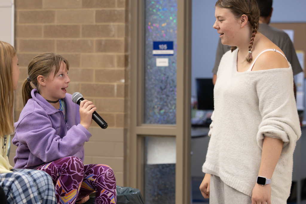 A Paul Norton student speaking to Kaija Anderson