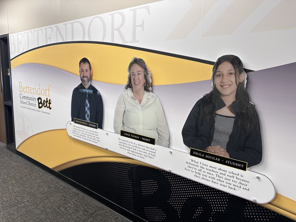 Receptionist was display featuring quotes from a teacher, parent, and student.