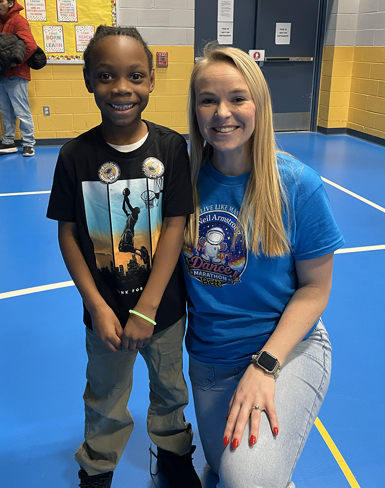 Dance Marathon - Student poses for a pic with teacher