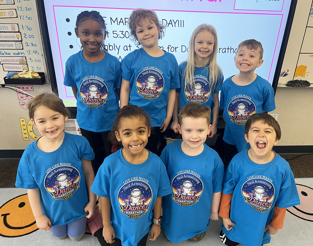 Dance Marathon - Students posing for a pic in their event t-shirts