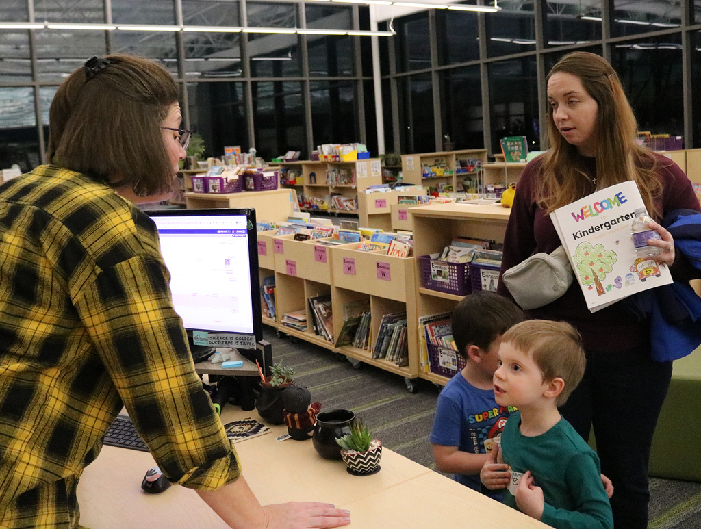Student sharing book suggestions with the school librarian
