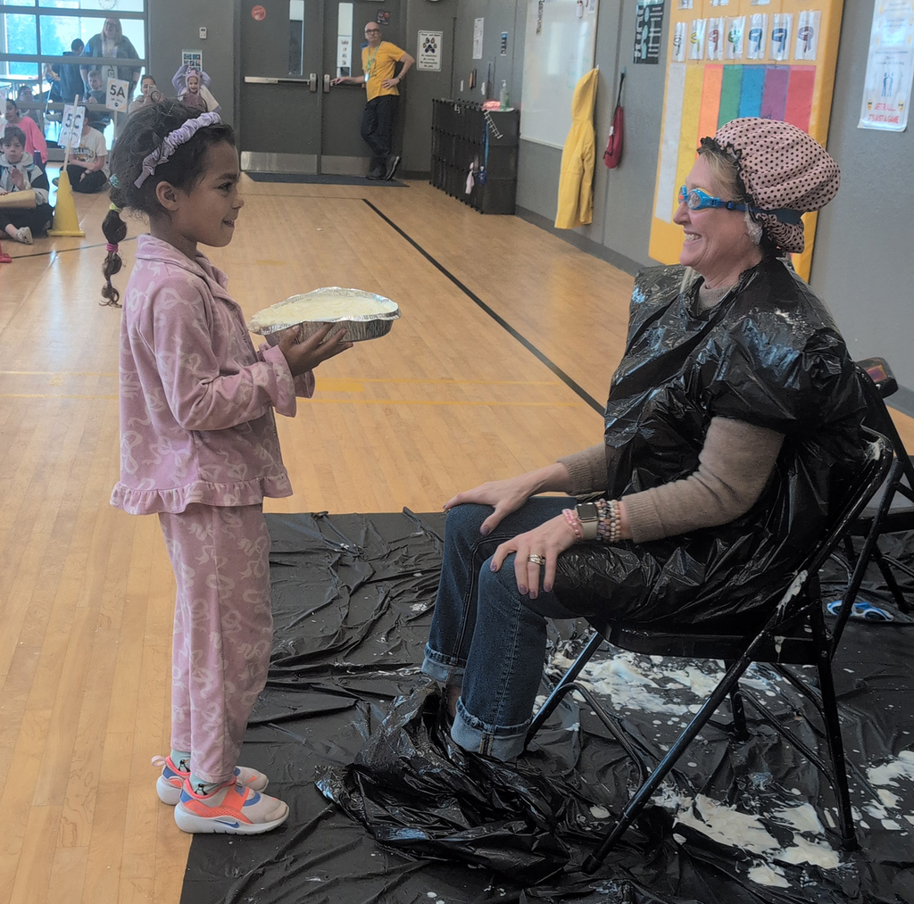 Student getting ready to pie principal Graap