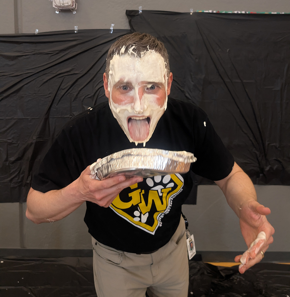 Matt Brenot sticking his tongue out with a face full of whipped cream