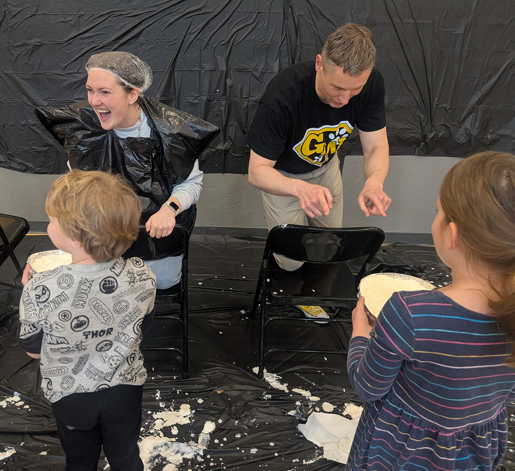 Lauren Petersen and Matt Brenot sitting down for a pie in hte face