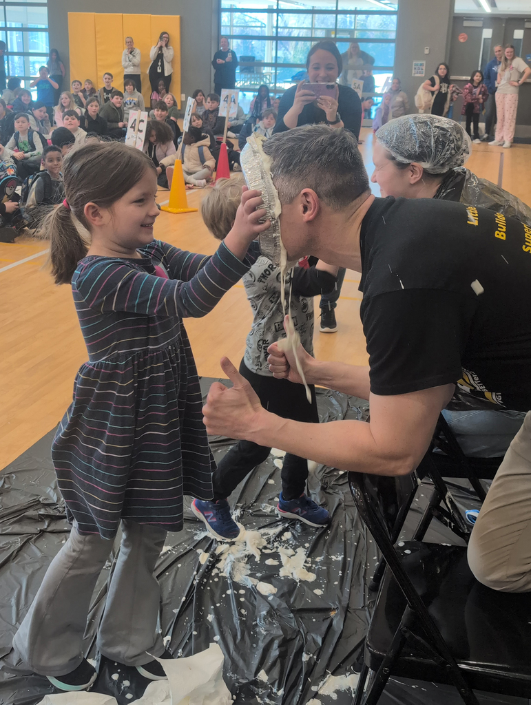 Matt Brenot gets a pie in the face
