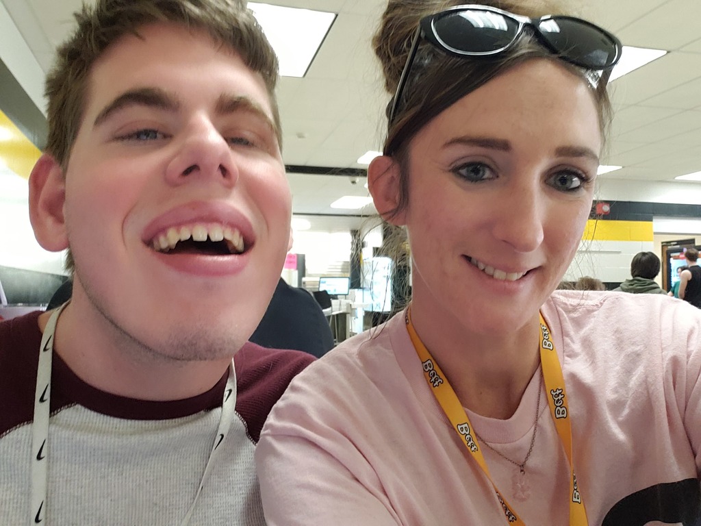 Jacqueline Osborn smiling with a student